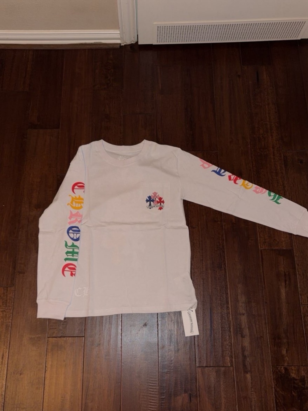While Long Sleeve Shirt With Multi Colored Graphic